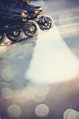 Road and wheels of roller skates closeup