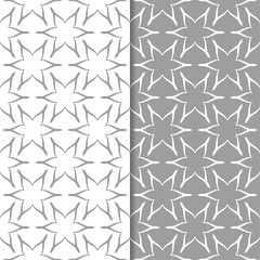 White and gray floral backgrounds. Set of seamless patterns