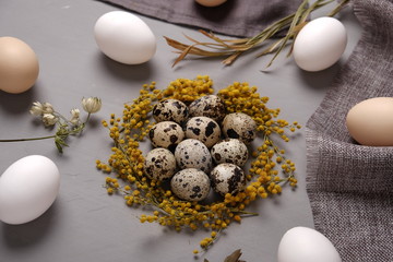 Eggs with flowers and decorative elements on concrete.