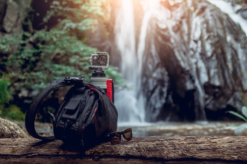 Camera bag with tool. Waterfall background