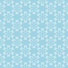 White floral seamless design on blue background