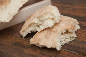 Pita Bread on Dark Rustic Wood table. Georgean Traditional Bread. Bakerry food Concept. Vertical image.