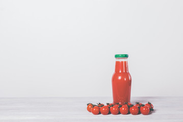 Bottle with red tomato juice