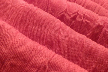 red natural fabric close-up background for decoration backdrop cotton ribbon coarse cloth scarlet color crumpled fabric abstract pattern texture pink silk