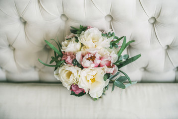 wedding bouquet of flowers on the sofa