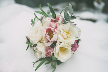 wedding bouquet on the snow