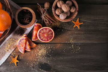 Fresh red orange fruit, anise, cinnamon and walnuts