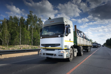 Truck on road, blue sky, cargo transportation concept