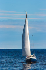 Fototapeta premium Blue sailboat at journey