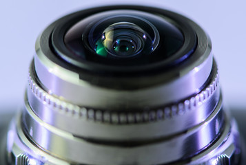 Fototapeta na wymiar Close-up camera lens with gray backlight. Horizontal photo.
