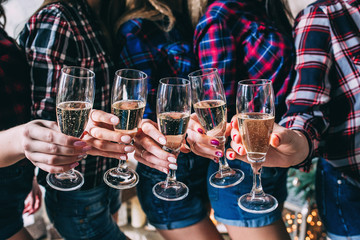 Guests congratulate the newlyweds with a glass of champagne in their hands.
