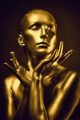 Golden lady on dark background