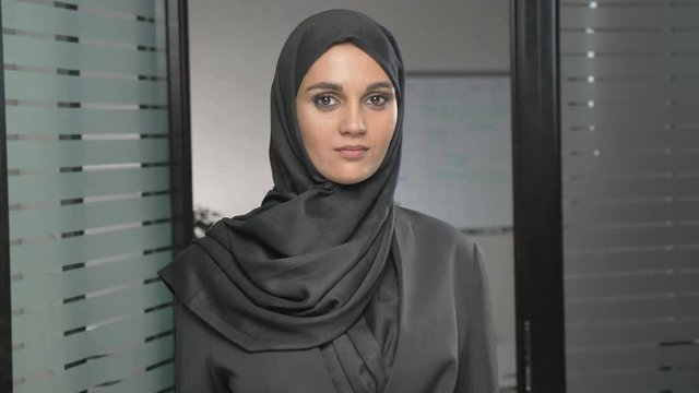 Portrait of Young woman in black hijab showing stop sign, Dislike, Rejecting Gesture, Disagree Sign 60 fps