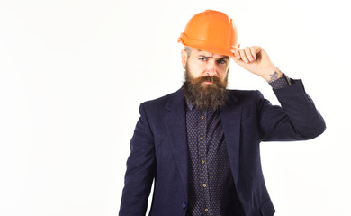 Builder wears construction helmet.