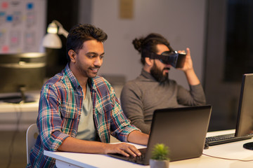 creative man with laptop working at office