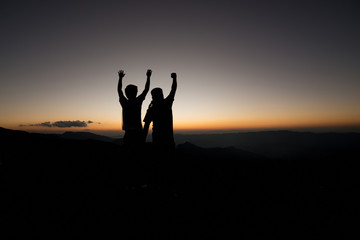 Silhouette boy Concept Show of hands up. Demonstrate success and victory