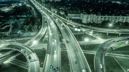 Highway. Road junctions. Conventions from the expressway. Crossroads Highway. Night view of motorways from a height.