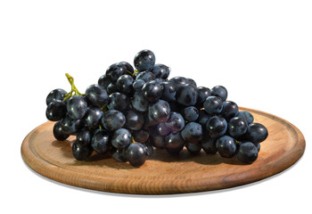 Blue grapes on a cutting board. Isolated on an white background.