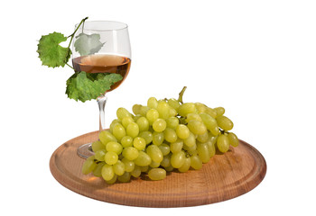 Ripe grapes with a glass of grape juice on the isolate.