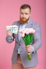 Handsome man holding bouquet of tulips