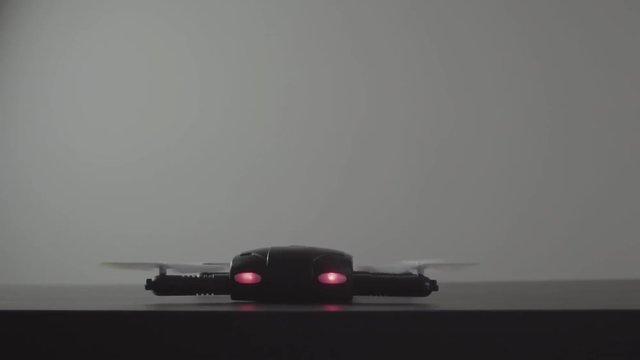 Futuristic transportation concept.Micro drone take off from laptop computer
