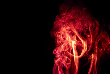 Obraz premium Red smoke on black background