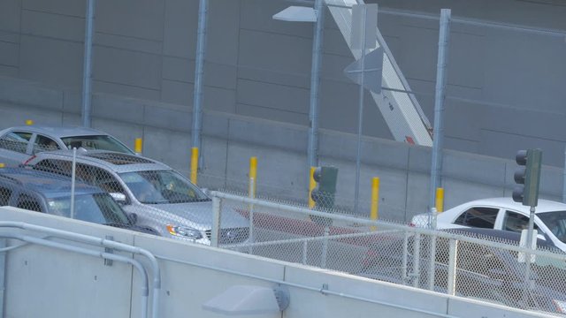 Cars driving in secure area near the international border.