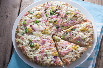 French creme from age pizza with red onion, ham, mustard honey sauce