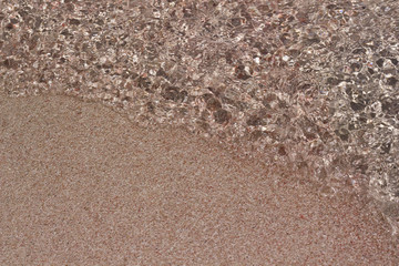 Close up to the pink colored sand on the beach Elafonissi in Greece