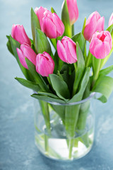 Pink tulips in a glass vase