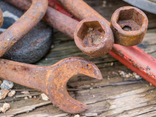 Antique Rusty Wrenches And Tools On Wooden Bench