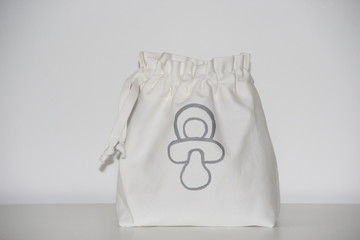 white cotton baby bag, baby accessories décoration © violeau
