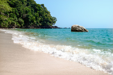 Krating bay with clean wave sea in sunshine