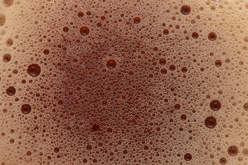 Beautiful bubbles of sweet soda brown color. Fizzy