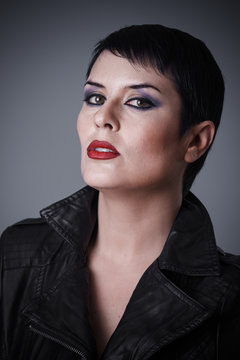Androgyne, Brunette woman dressed in leather jacket, androgynous appearance, beauty and short hair