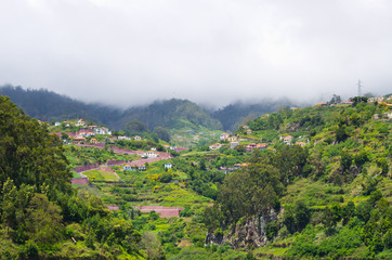 Fototapeta na wymiar Hills covered by clouds, Madeira island - Portugal