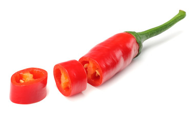 sliced red hot chili peppers isolated on white background