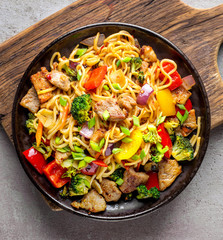 Plate of noodles with meat and vegetables