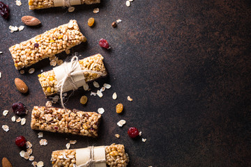 Granola bars on dark stone table. Top view.