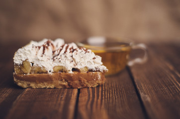 cake with tea on wooden desk