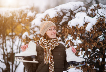 the girl on the figured skates on a opened skating rink