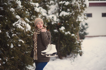 the girl on the figured skates on a opened skating rink