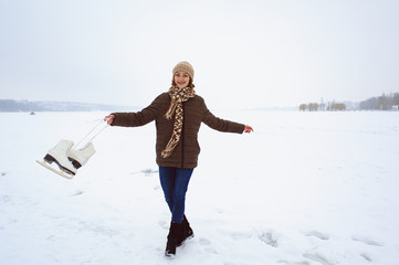 the girl on the figured skates on a opened skating rink