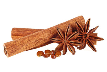 Cinnamon sticks and anise stars on a white background