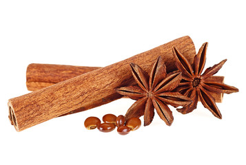 Cinnamon sticks and anise stars on a white background