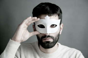 Businessman hidden behind the mask