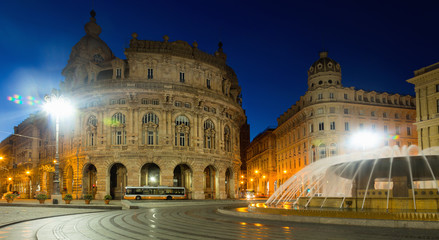Fototapeta na wymiar Night light of The Ferrari Square with fountain in Genoa of Italy