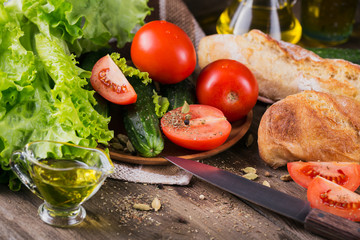tomato, cucumber, lettuce, baguette, olive oil and spices
