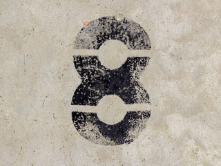 Number eight 8 on concrete wall background