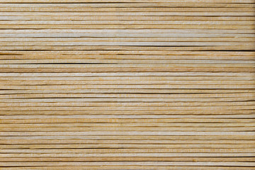 Texture of wood made of ice cream sticks. Side view.